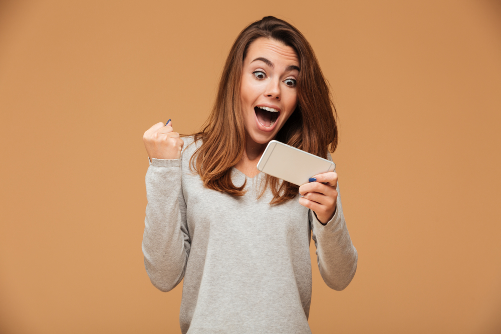 woman playing online lottery or scratch cards